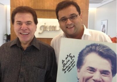 Geraldo ao lado de Silvio Santos. (Foto: Reprodução)