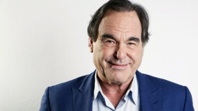 In this Wednesday, Nov. 14, 2012, photo, American film director, screenwriter and producer Oliver Stone poses for a portrait in New York. Oliver Stone has never been shy about ruffling feathers with his take real-life events. From “J.F.K” and “Nixon,” to “Salvador” and “W,” Stone has challenged the history that we know by incorporating a revisionist view. His latest project, “The Untold History of the United States,