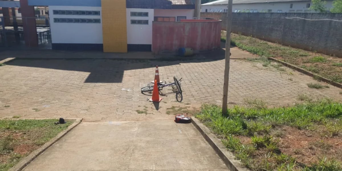 Criança e padrasto estavam entrando em escola quando foram baleados (Foto: Henrique Zuba/ Inter TV )